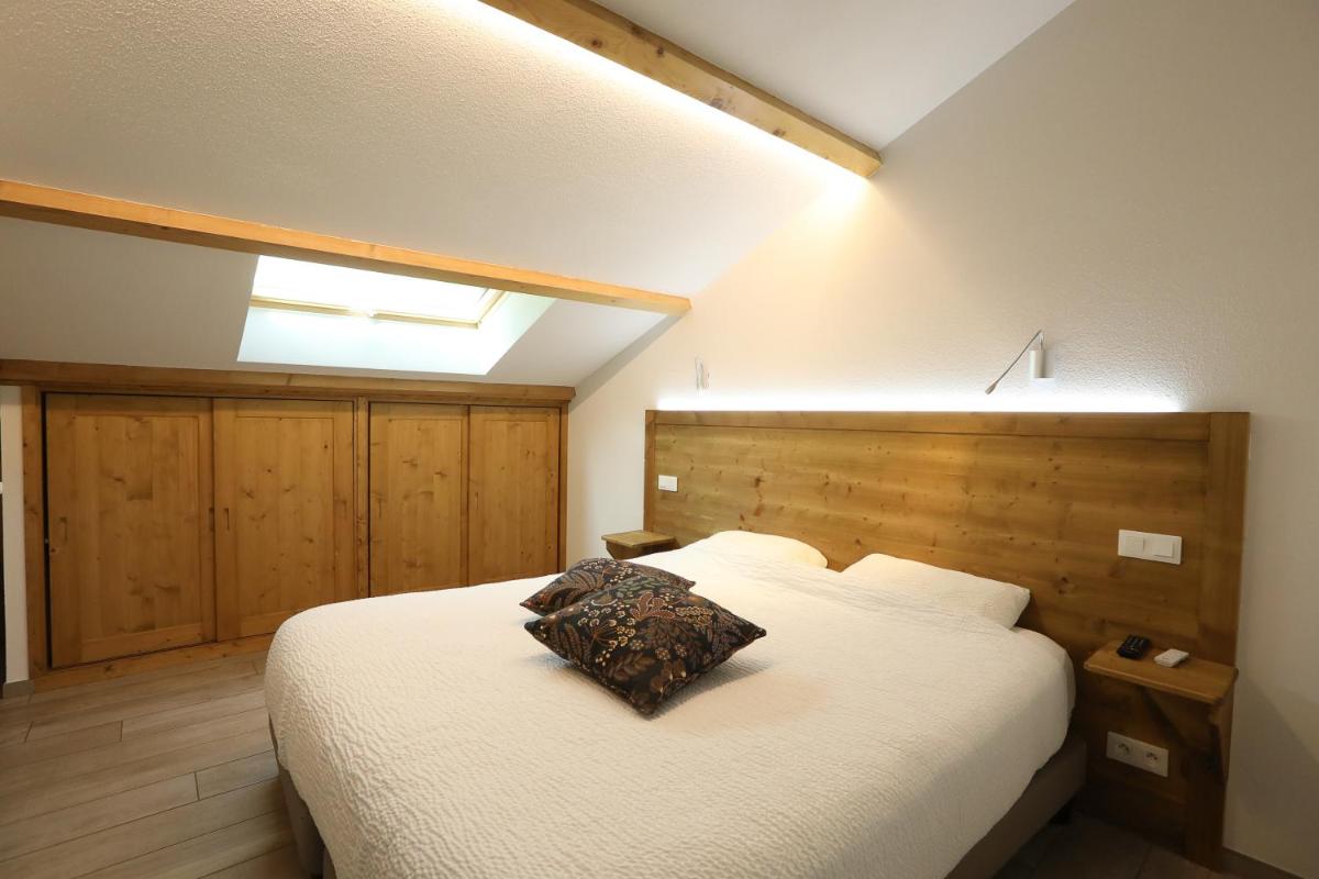 Un ou plusieurs lits dans un hébergement de l'établissement Logis Hotel Spa Restaurant Le Provence