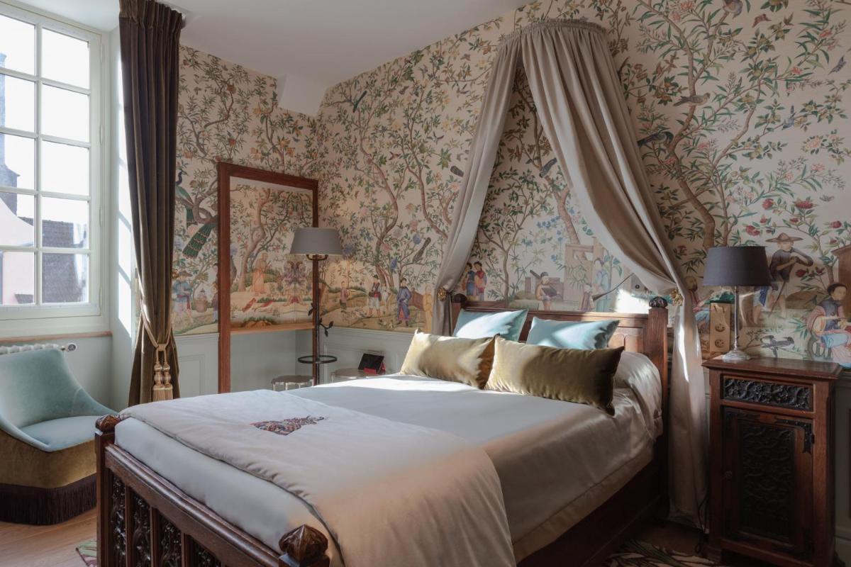 Un ou plusieurs lits dans un hébergement de l'établissement Hôtel Le Cep & Spa