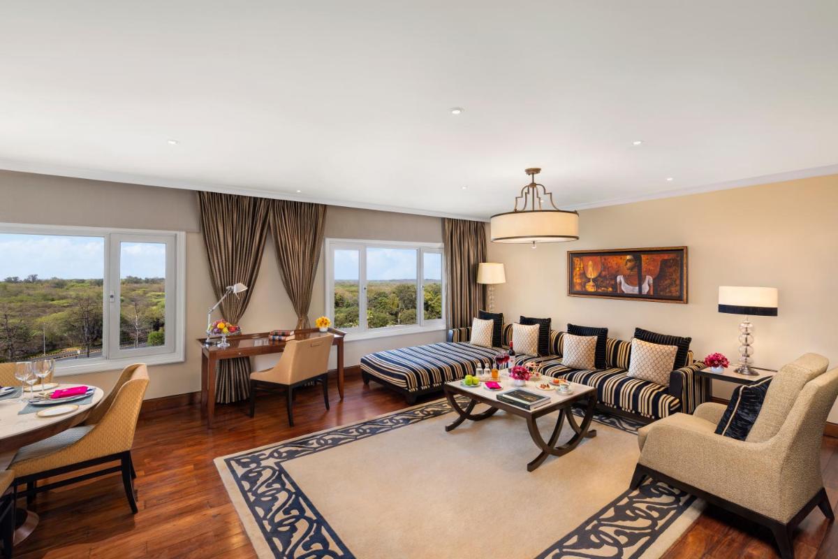 a living room with a couch and a table at Taj Palace, New Delhi in New Delhi a living room with a couch and a table at Taj Palace, New Delhi in New Delhi