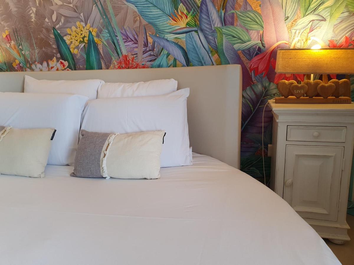 Un ou plusieurs lits dans un hébergement de l'établissement Le Belvédère Hotel et Bien être