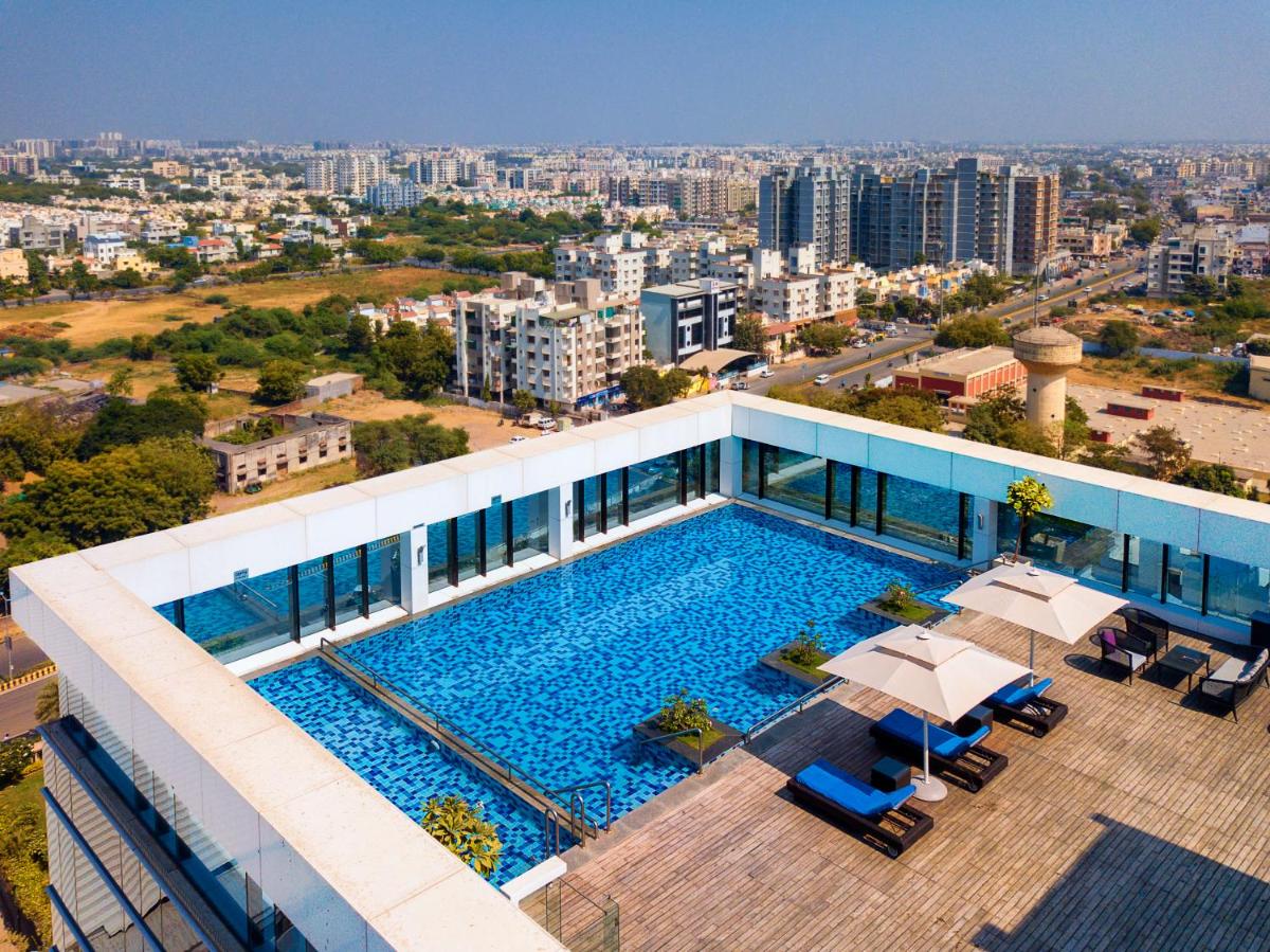 a swimming pool on the roof of a building at Renaissance Ahmedabad Hotel in Ahmedabad