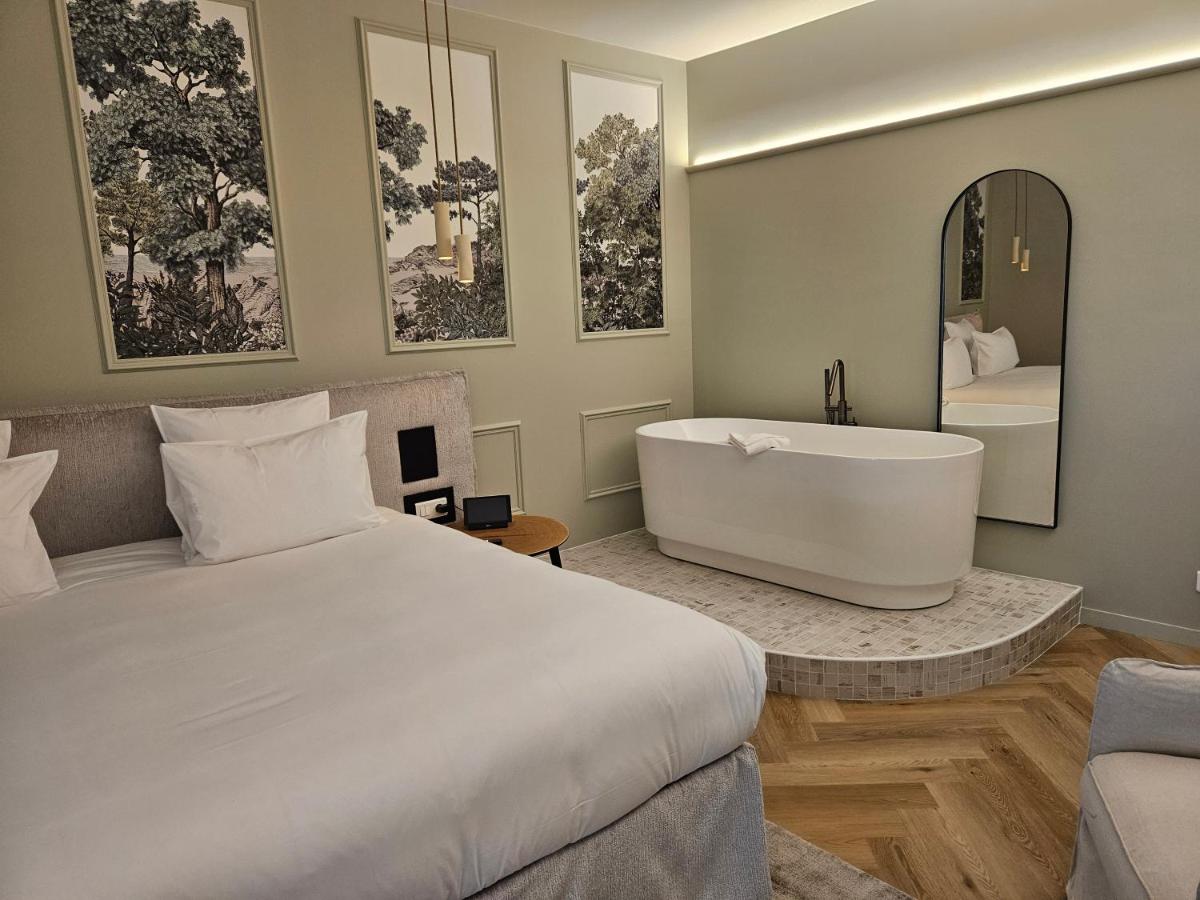 Un ou plusieurs lits dans un hébergement de l'établissement Le Belvédère Hotel et Bien être