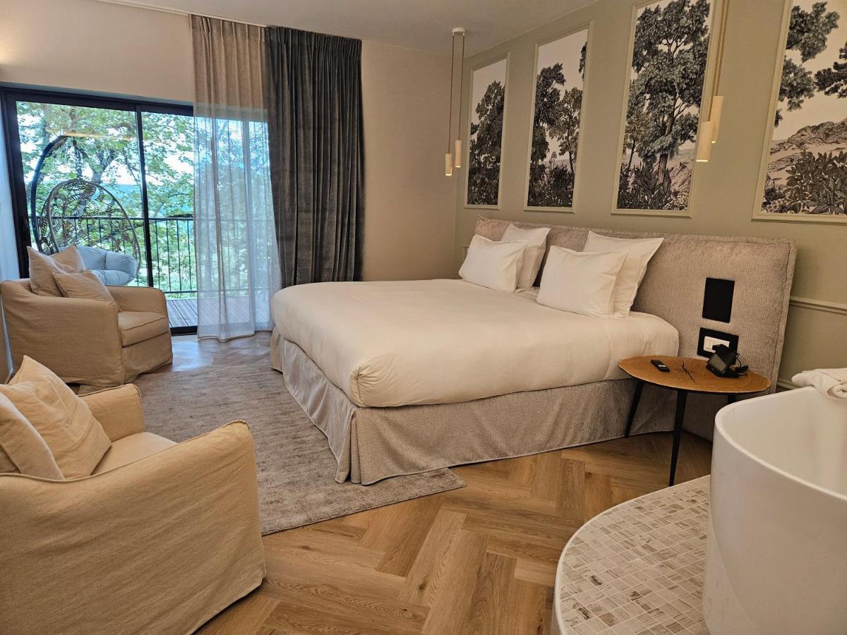 Un ou plusieurs lits dans un hébergement de l'établissement Le Belvédère Hotel et Bien être