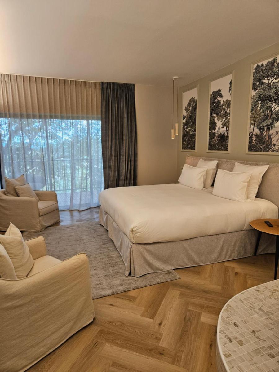 Coin salon dans l'établissement Le Belvédère Hotel et Bien être