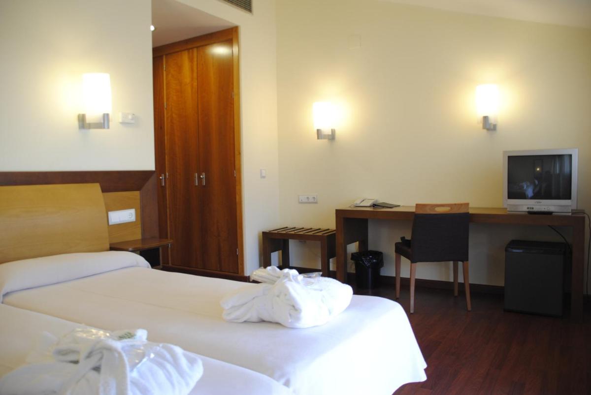 Cama o camas de una habitación en Salugral Termal Resort