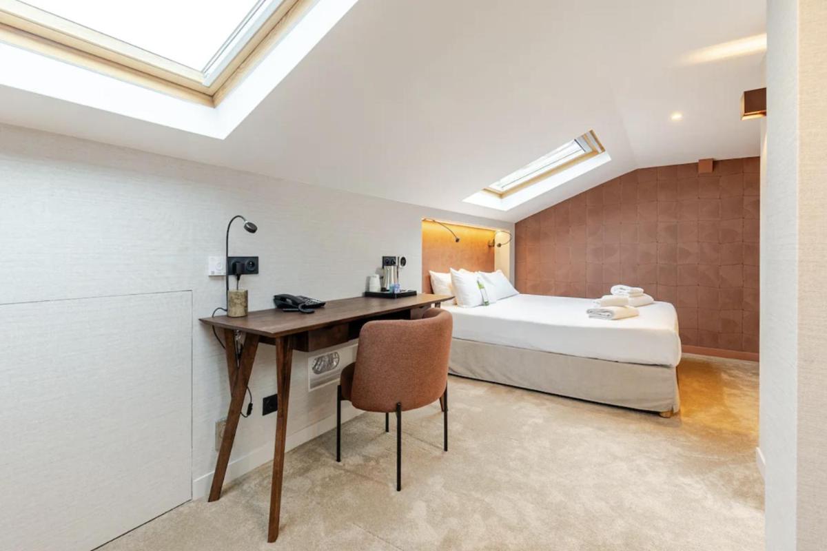 Un ou plusieurs lits dans un hébergement de l'établissement Atypik Hotel