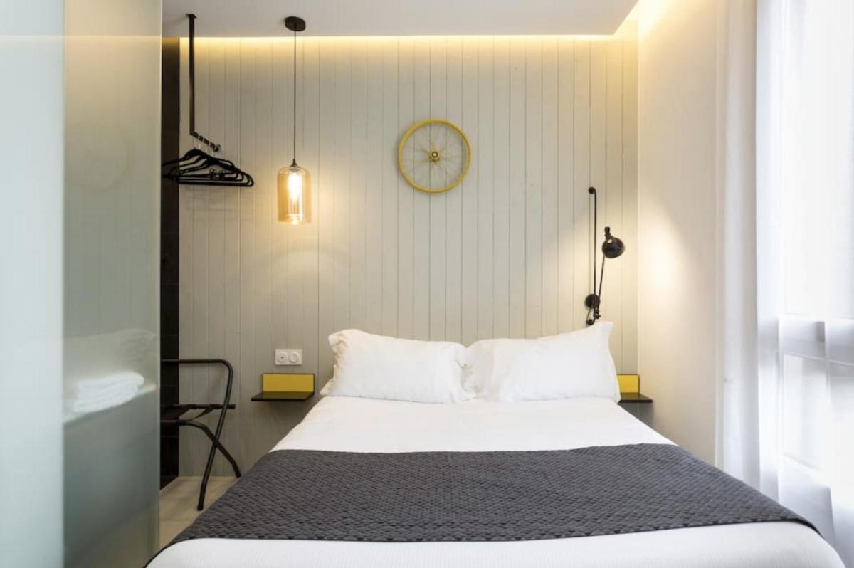 Un ou plusieurs lits dans un hébergement de l'établissement Atypik Hotel