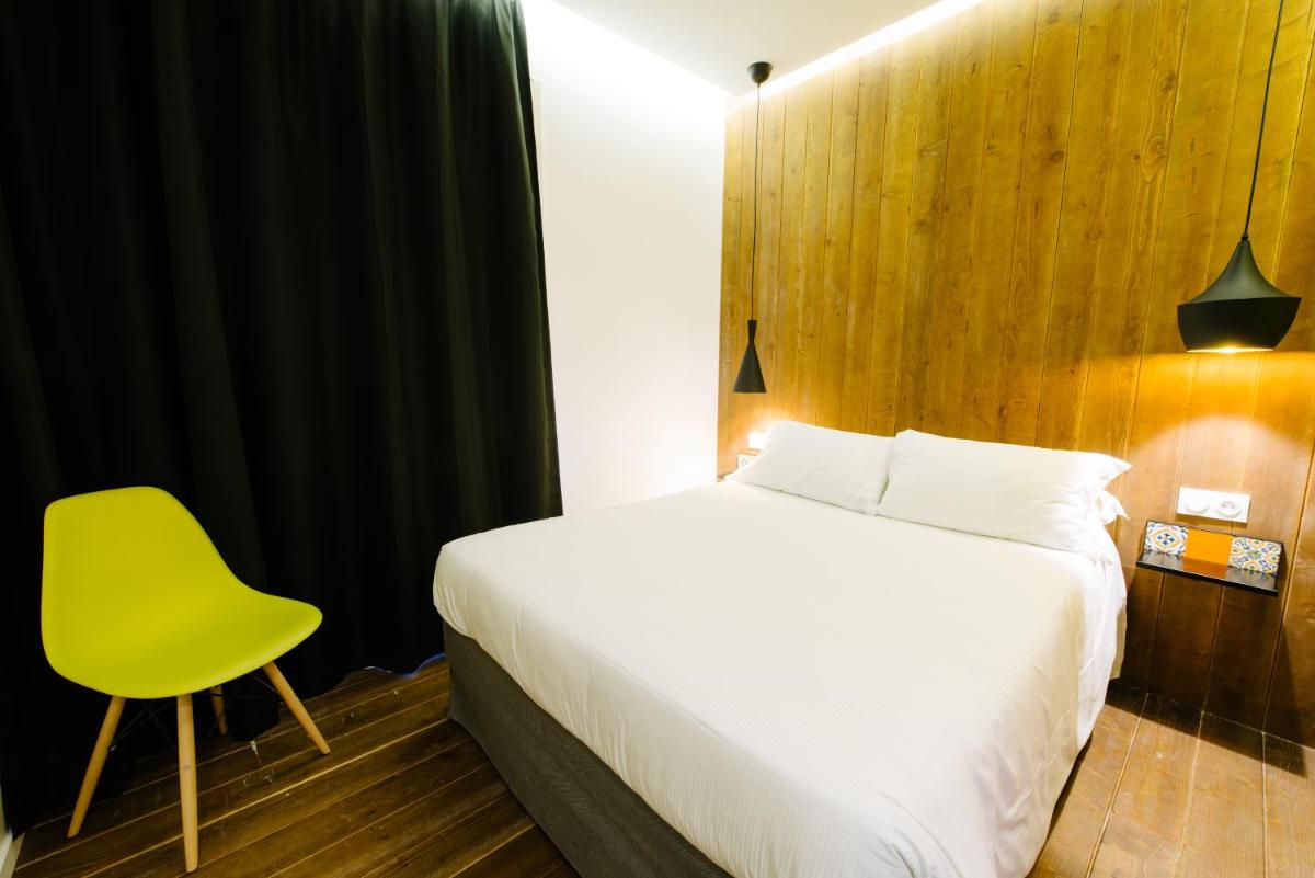 Un ou plusieurs lits dans un hébergement de l'établissement Atypik Hotel