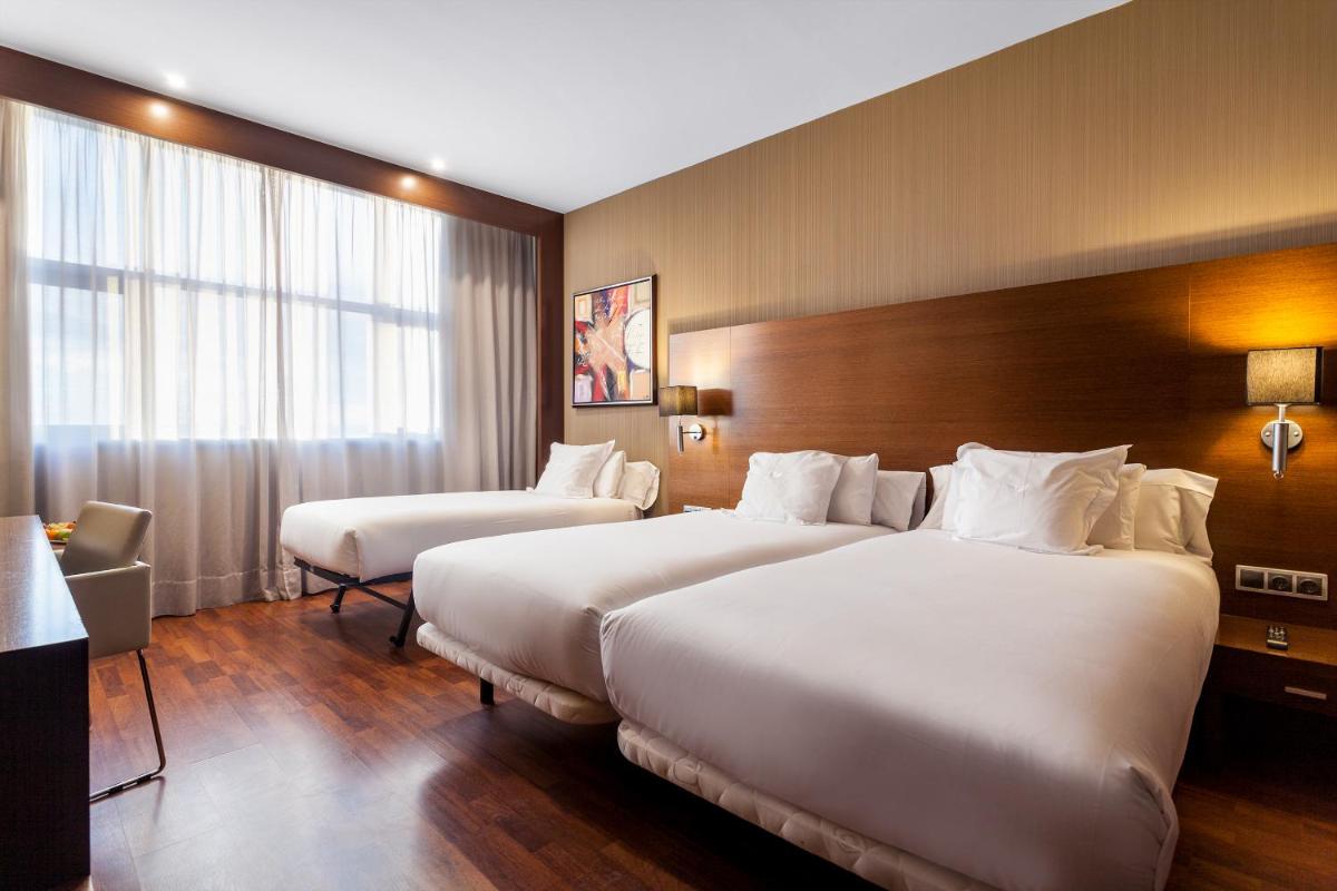 Cama o camas de una habitación en AZZ Valencia Congress Hotel & Spa
