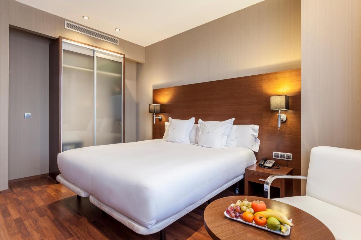 Cama o camas de una habitación en AZZ Valencia Congress Hotel & Spa