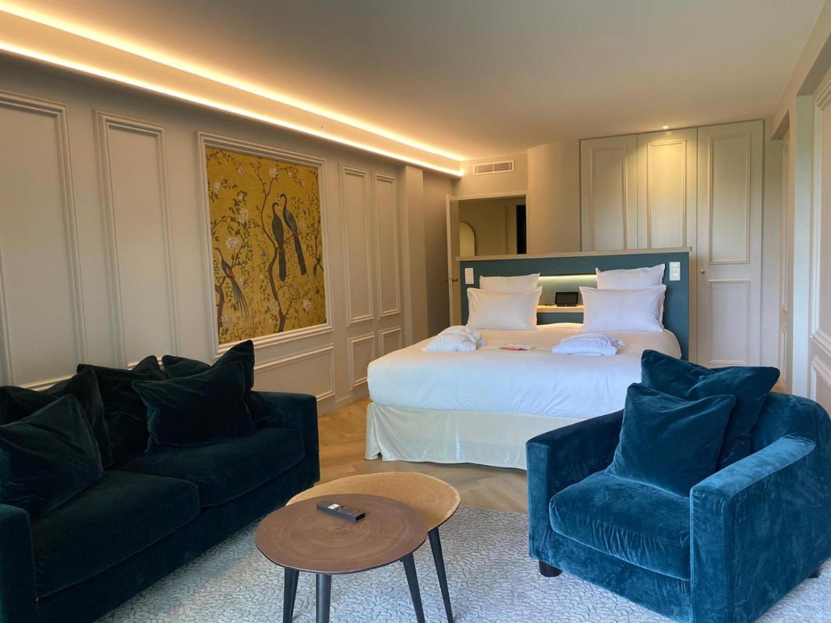 Un ou plusieurs lits dans un hébergement de l'établissement Le Belvédère Hotel et Bien être
