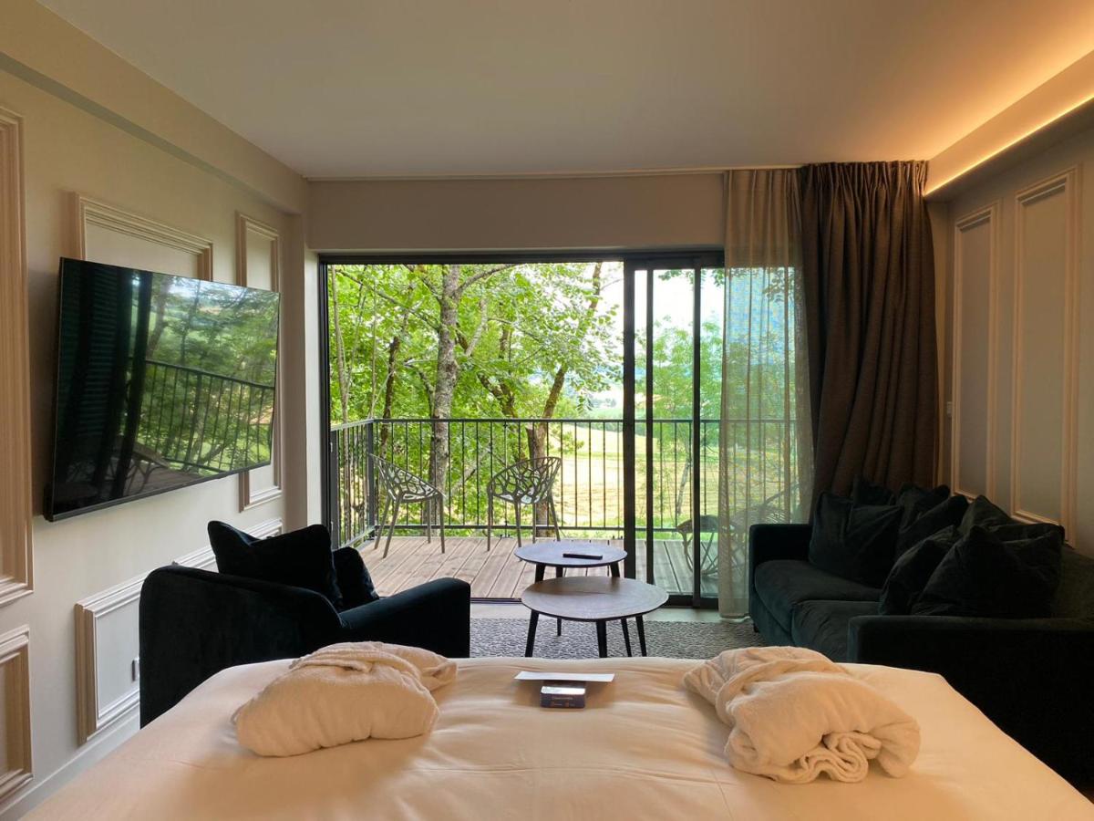 Un ou plusieurs lits dans un hébergement de l'établissement Le Belvédère Hotel et Bien être