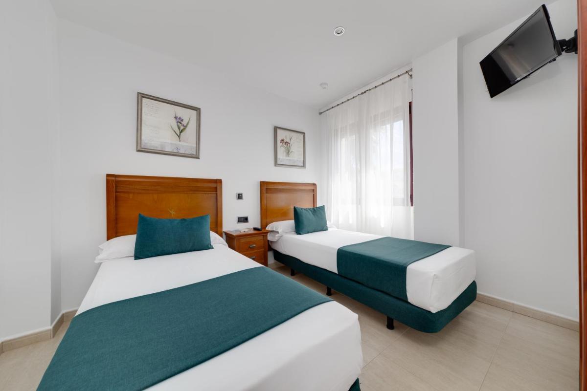 Cama o camas de una habitación en Daniya Denia Spa & Business 4*