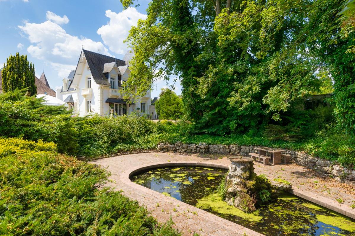 Jardin de l'établissement Le Moulin Du Landion Hôtel et Spa
