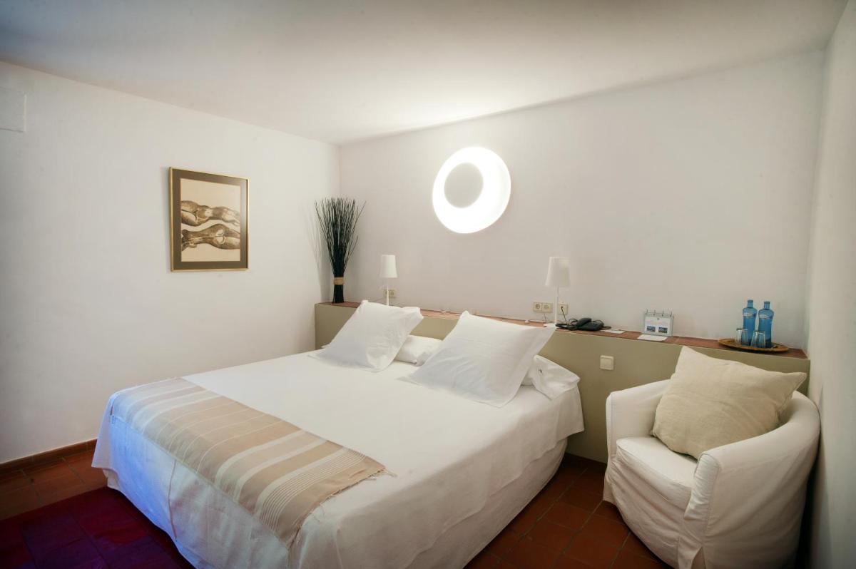 Cama o camas de una habitación en Mas Falgarona Hotel Boutique & SPA
