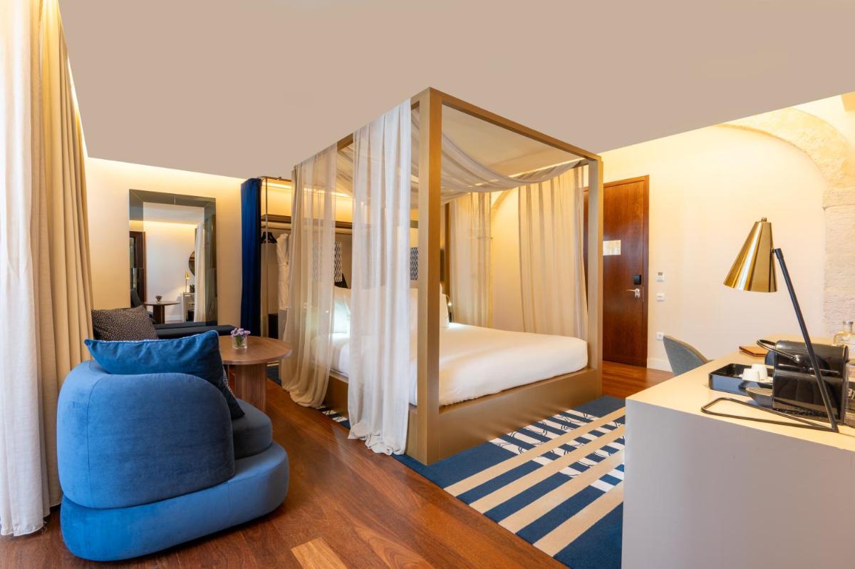 Uma cama ou camas num quarto em Palácio do Governador - Lisbon Hotel & Spa