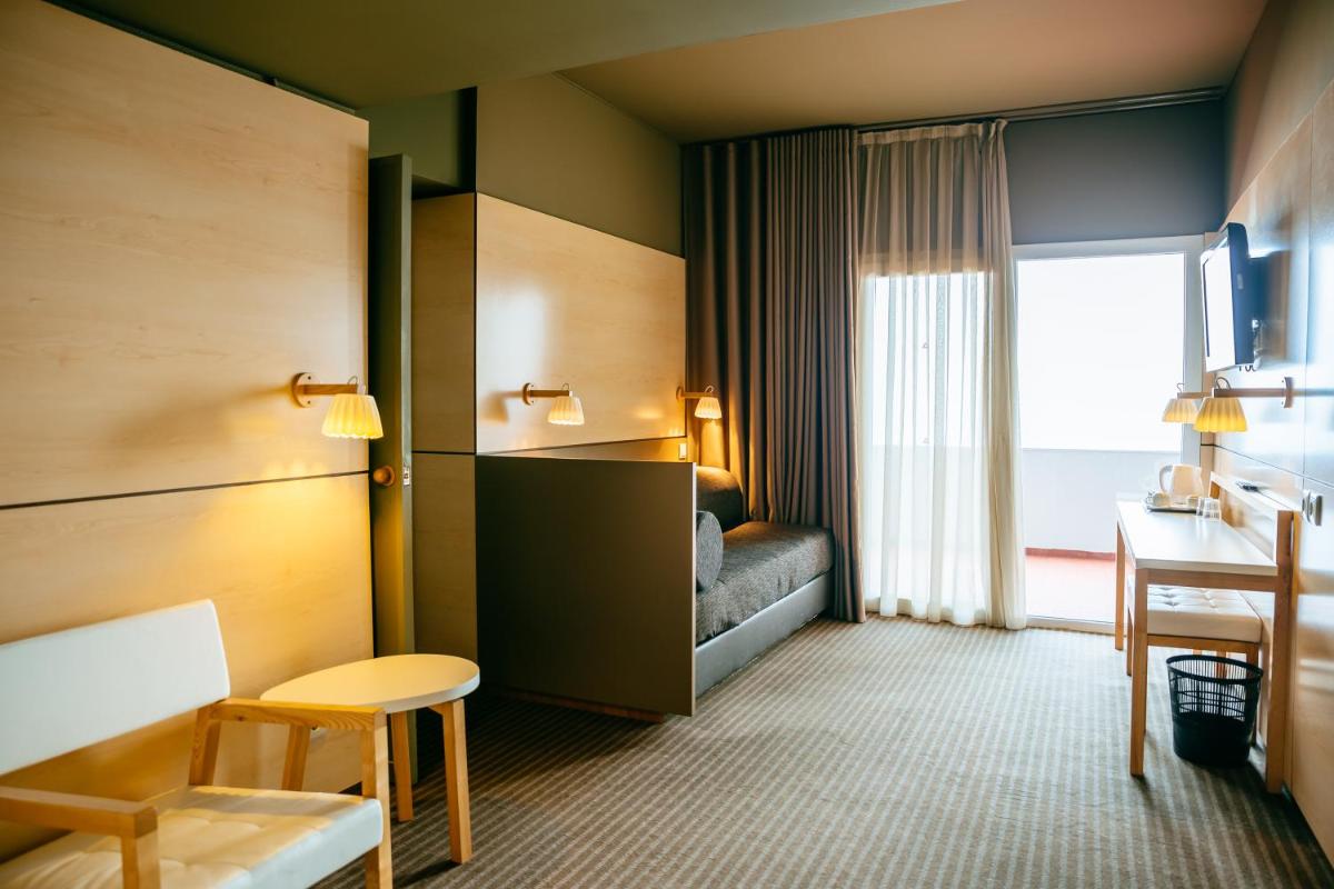 Uma cama ou camas num quarto em Axis Vermar Conference & Beach Hotel