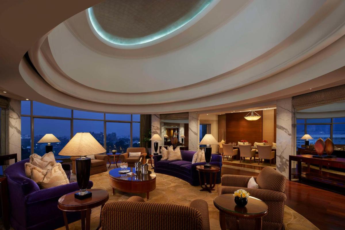 a living room with purple furniture and a domed ceiling at Hyatt Regency Kolkata in Kolkata a living room with purple furniture and a domed ceiling at Hyatt Regency Kolkata in Kolkata