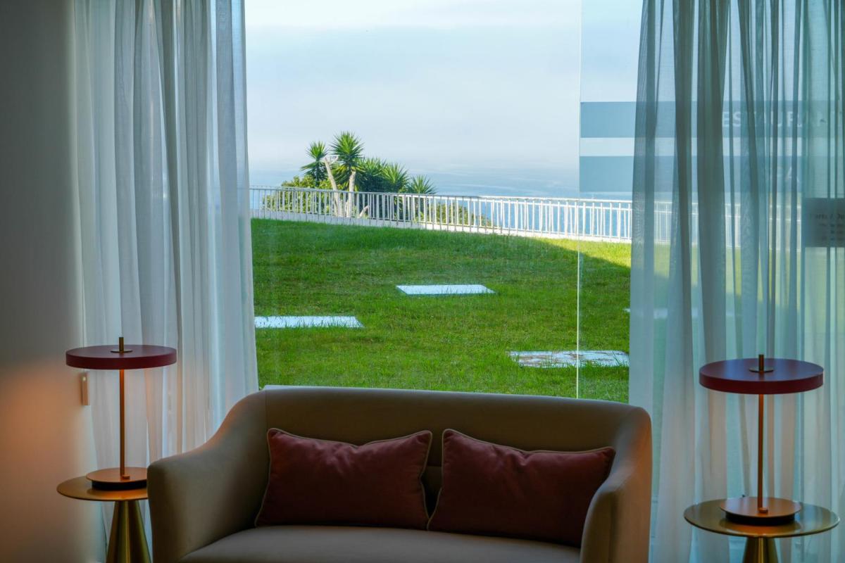 Uma área de estar em Miramar Hotel Spa & Apartments