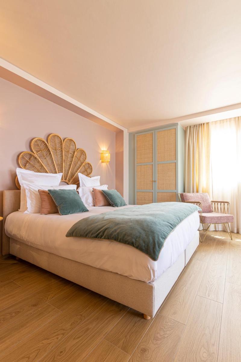 Un ou plusieurs lits dans un hébergement de l'établissement Hotel Riva Beach