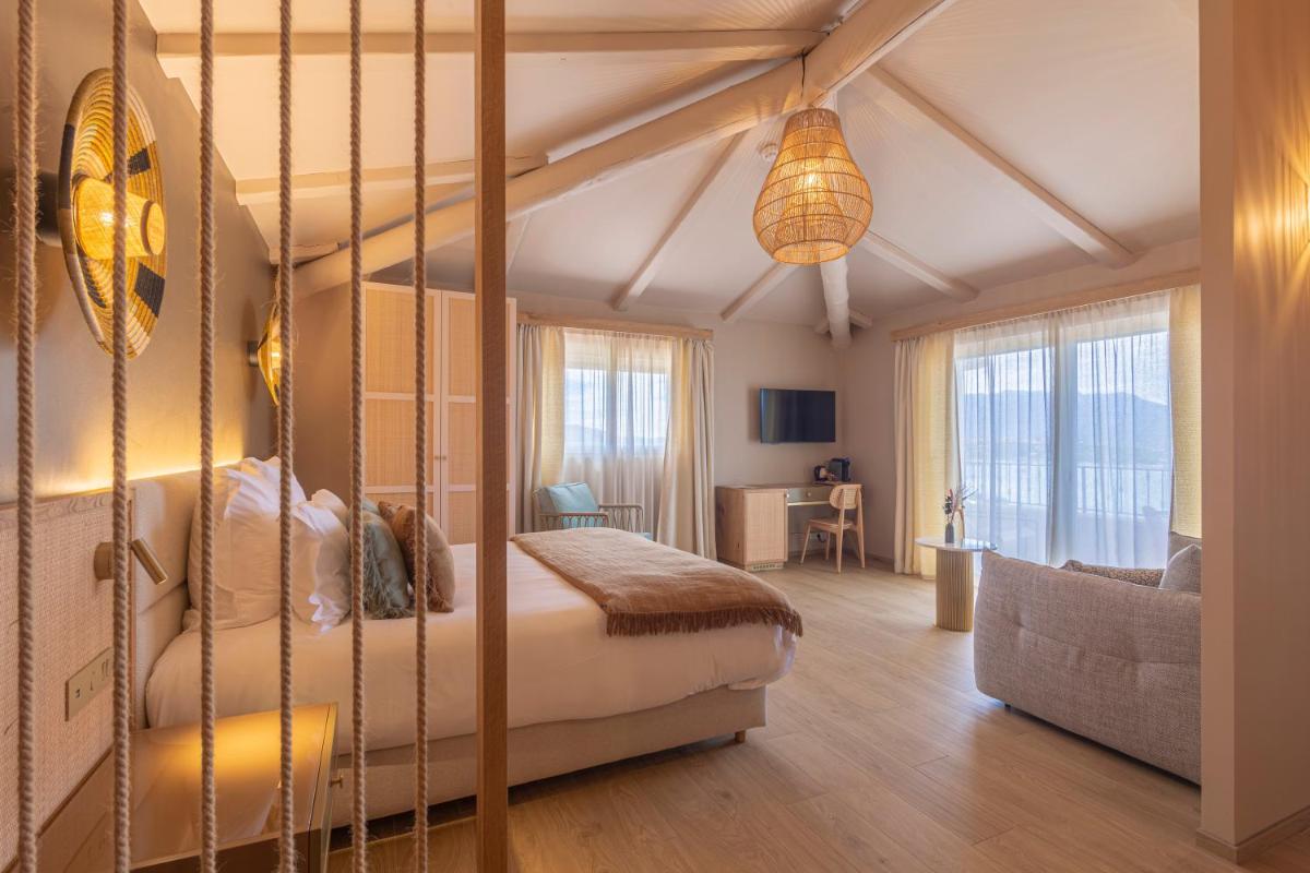 Un ou plusieurs lits dans un hébergement de l'établissement Hotel Riva Beach