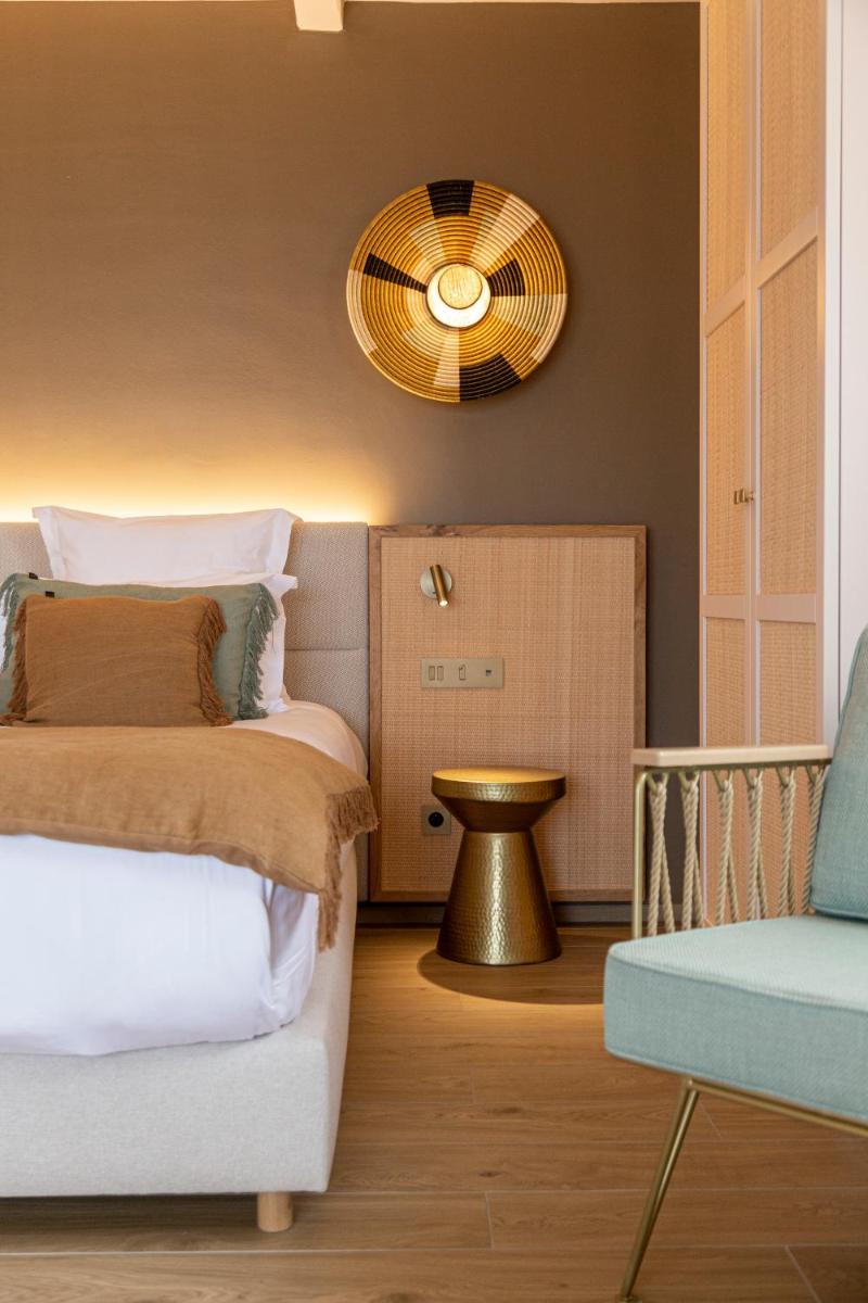 Un ou plusieurs lits dans un hébergement de l'établissement Hotel Riva Beach
