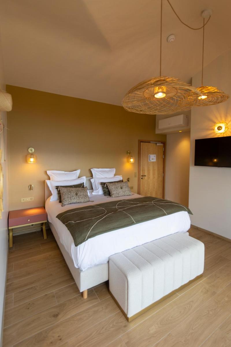 Un ou plusieurs lits dans un hébergement de l'établissement Hotel Riva Beach
