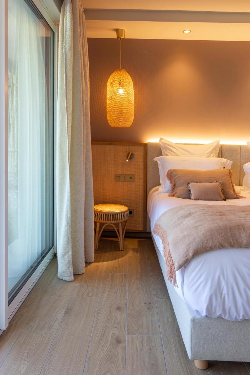 Un ou plusieurs lits dans un hébergement de l'établissement Hotel Riva Beach