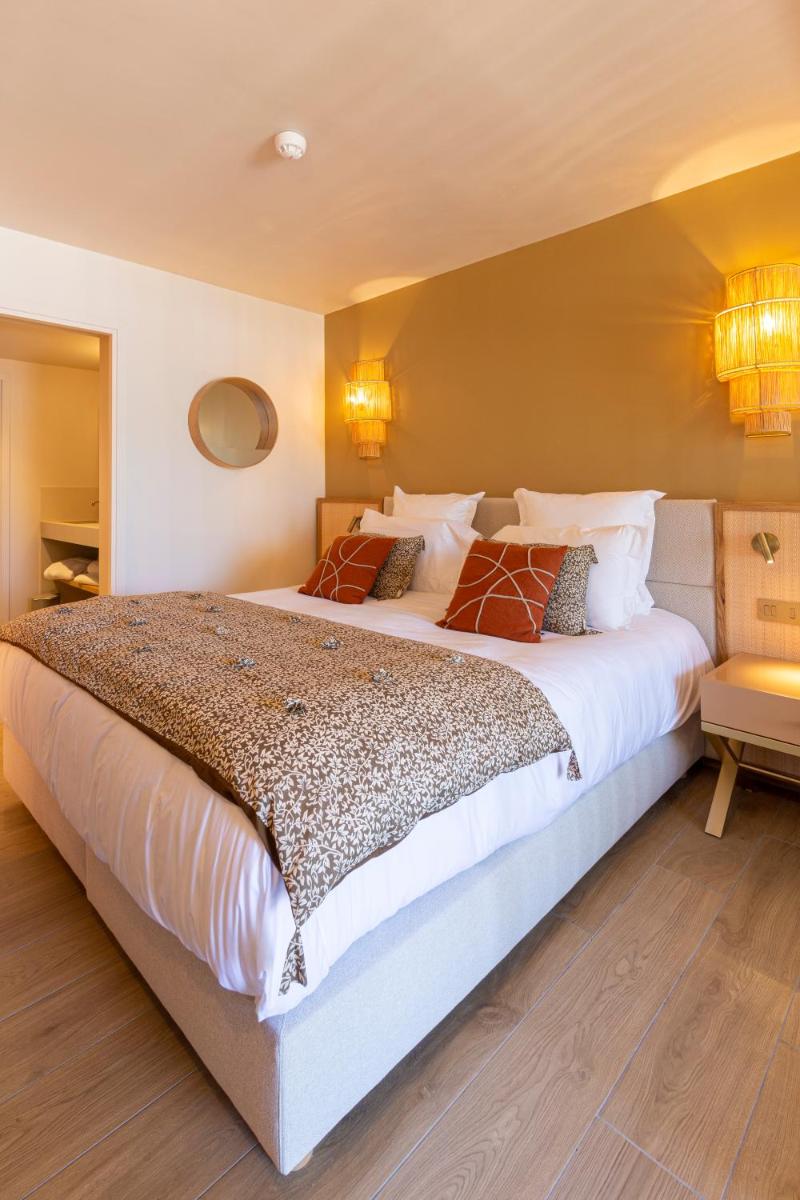Un ou plusieurs lits dans un hébergement de l'établissement Hotel Riva Beach