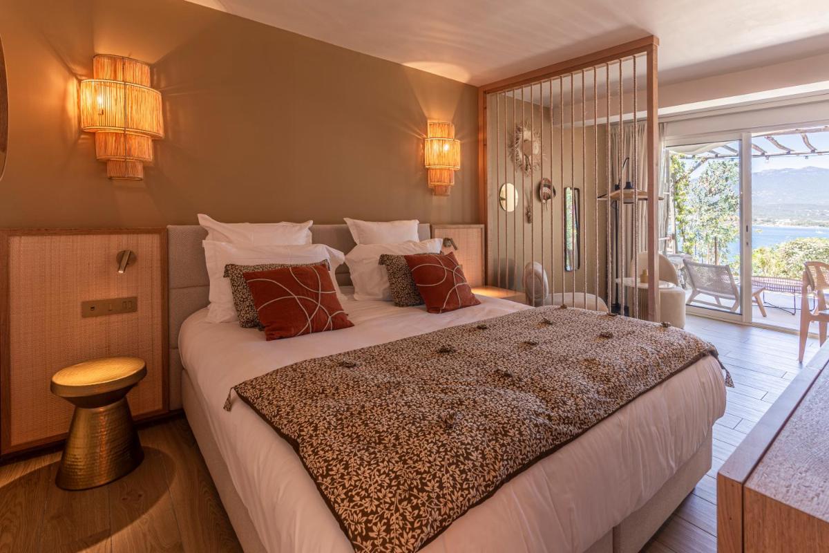 Un ou plusieurs lits dans un hébergement de l'établissement Hotel Riva Beach