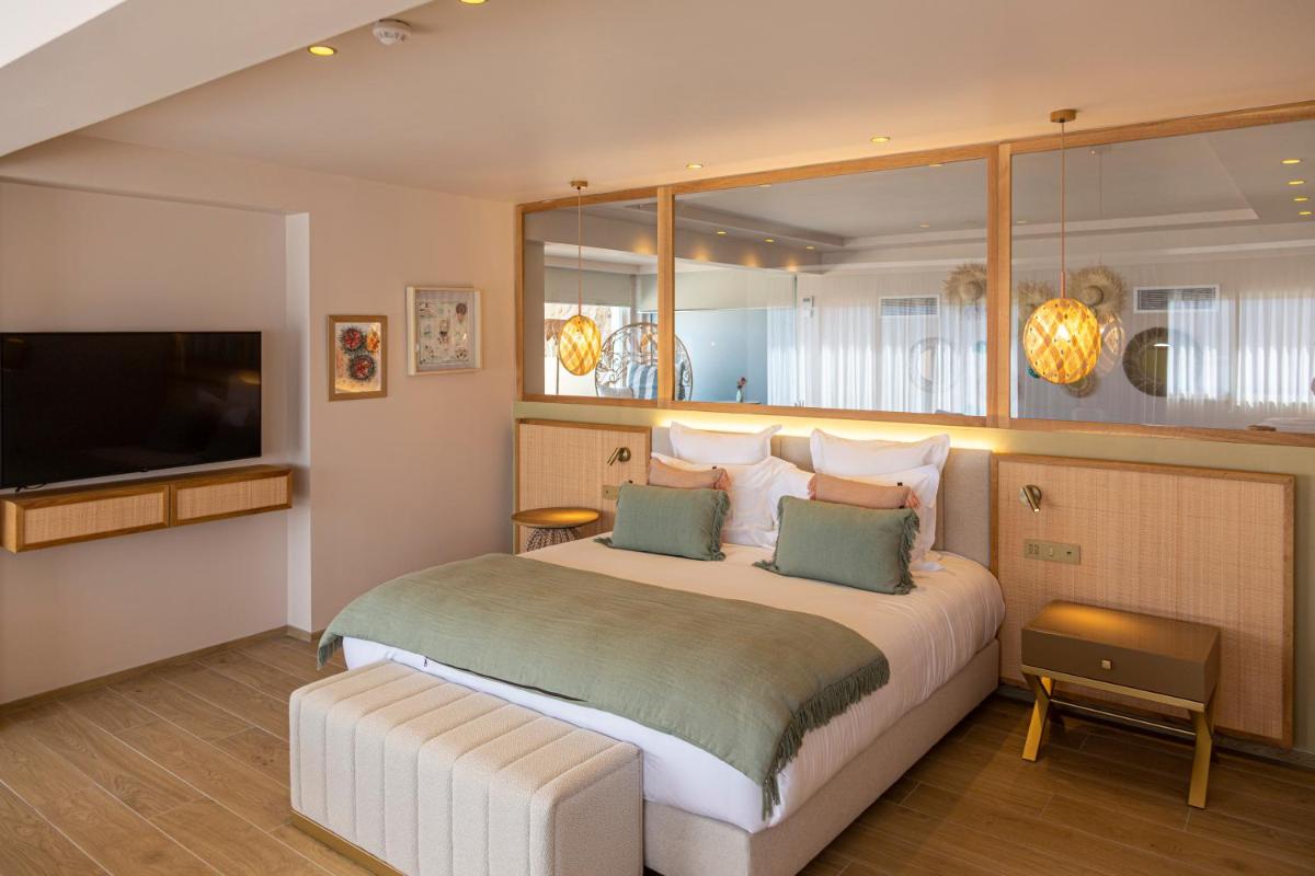 Un ou plusieurs lits dans un hébergement de l'établissement Hotel Riva Beach