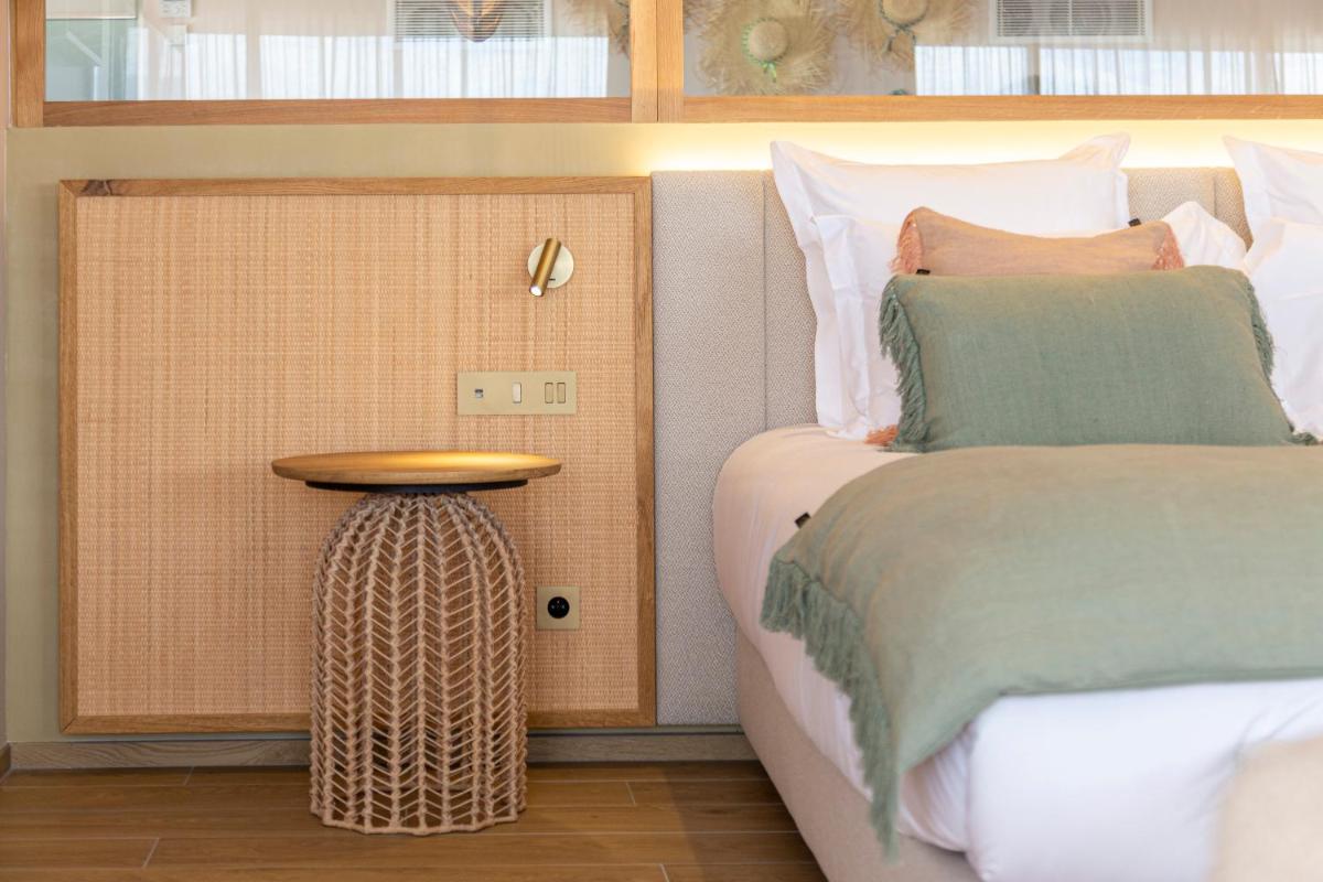 Un ou plusieurs lits dans un hébergement de l'établissement Hotel Riva Beach