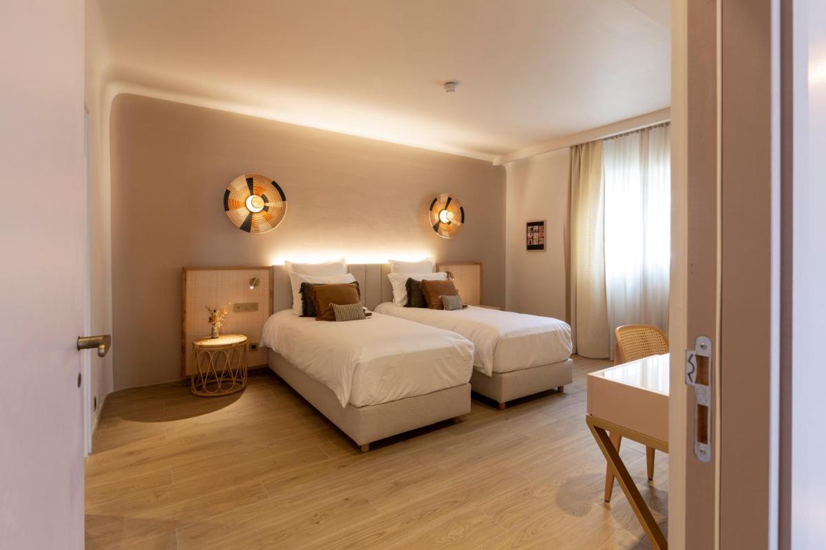 Un ou plusieurs lits dans un hébergement de l'établissement Hotel Riva Beach