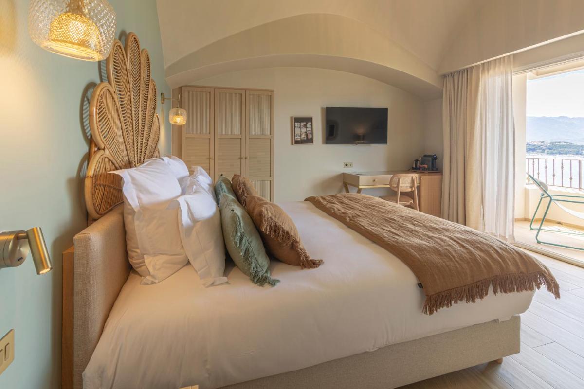 Un ou plusieurs lits dans un hébergement de l'établissement Hotel Riva Beach