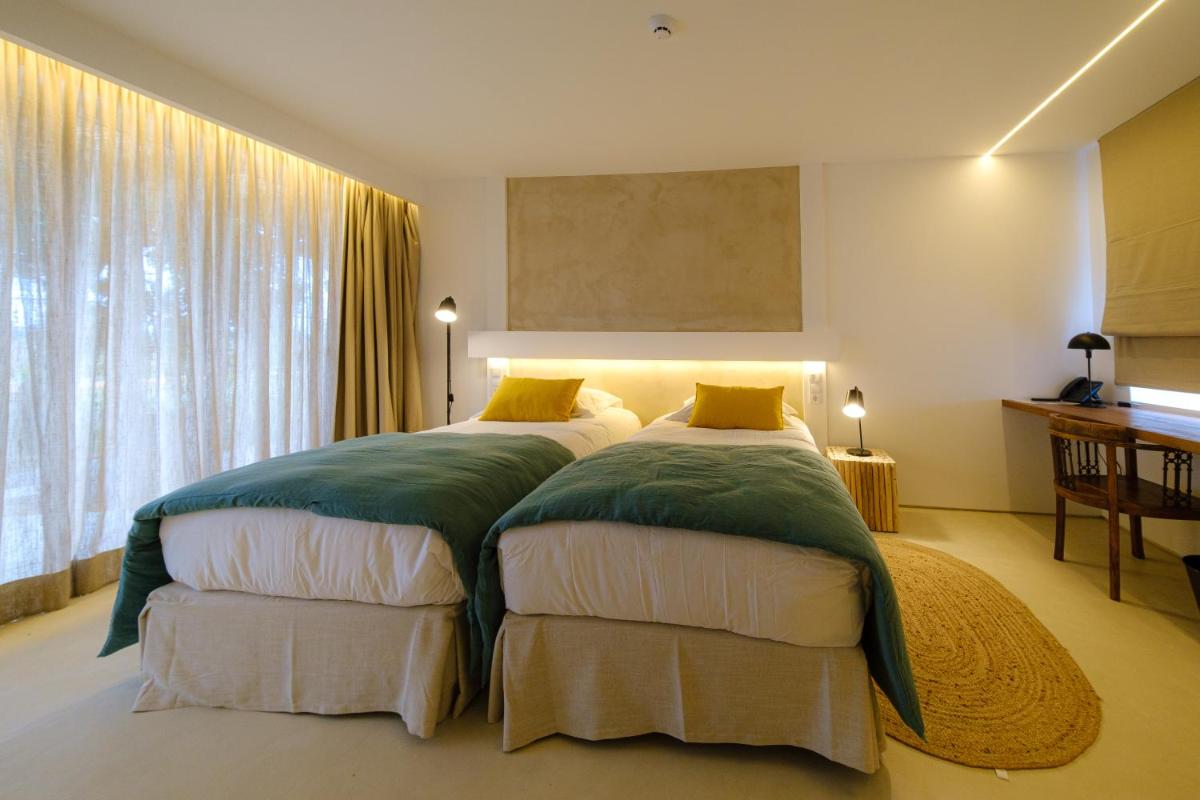 Uma cama ou camas num quarto em Sorraia Hotel Rural