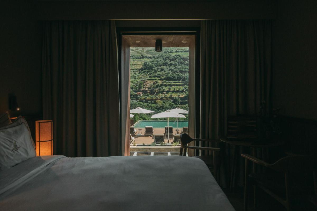 Uma cama ou camas num quarto em Torel Quinta da Vacaria - Douro Valley
