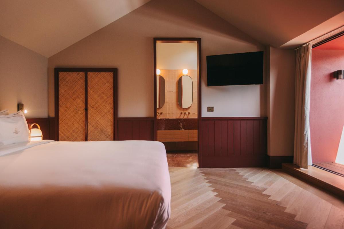 Uma cama ou camas num quarto em Torel Quinta da Vacaria - Douro Valley