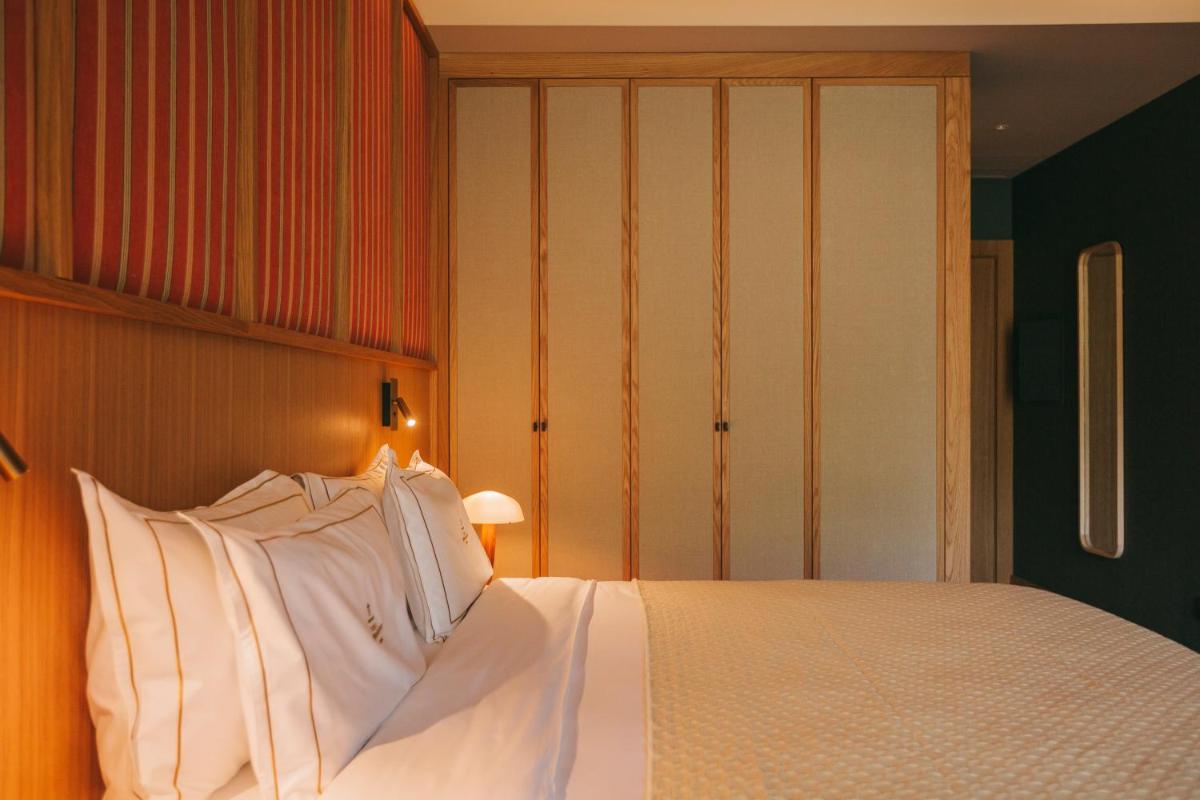 Uma cama ou camas num quarto em Torel Quinta da Vacaria - Douro Valley