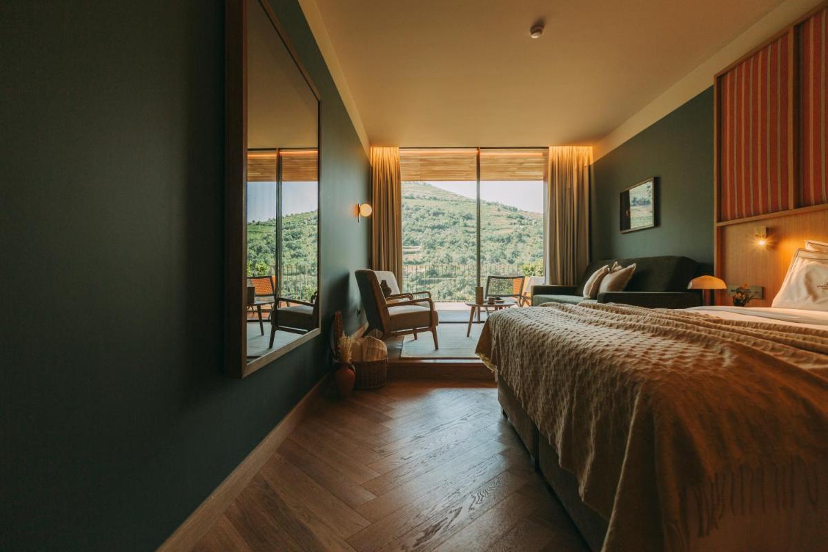 Uma cama ou camas num quarto em Torel Quinta da Vacaria - Douro Valley
