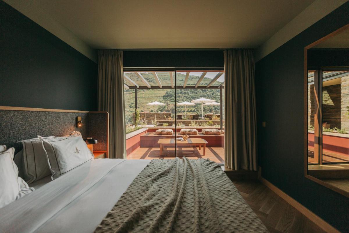 Uma cama ou camas num quarto em Torel Quinta da Vacaria - Douro Valley