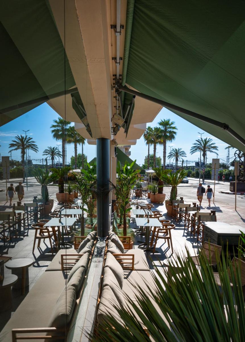 Un restaurante o sitio para comer en AQUA Hotel Promenade & Spa 4Sup