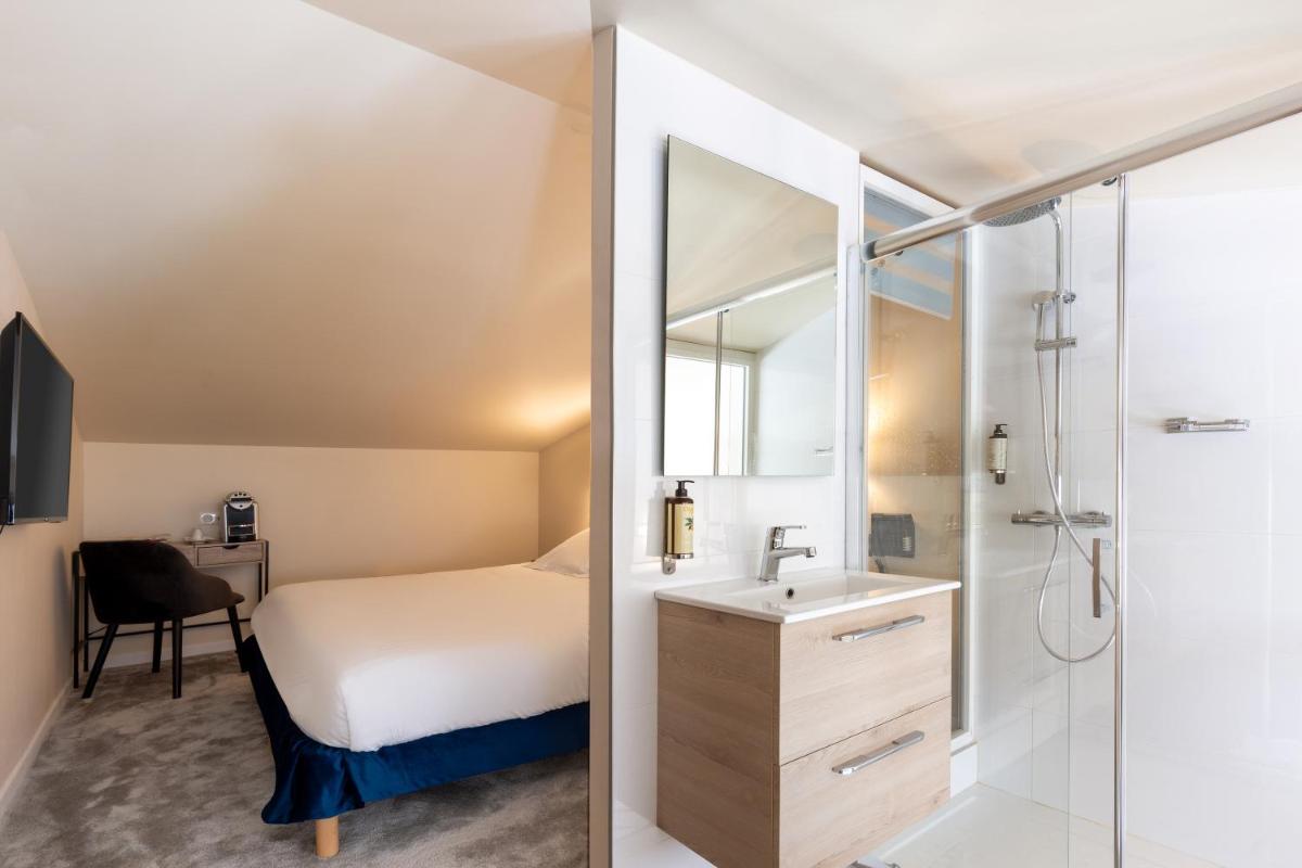 Un ou plusieurs lits dans un hébergement de l'établissement Best Western Hotel & SPA Coeur De Cassis