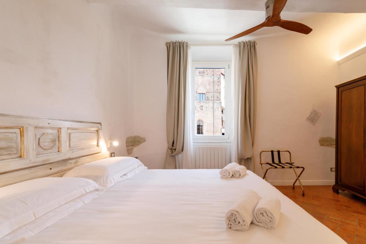 GuestHost - Charme in the Historic Centre of SIena - Hizvo