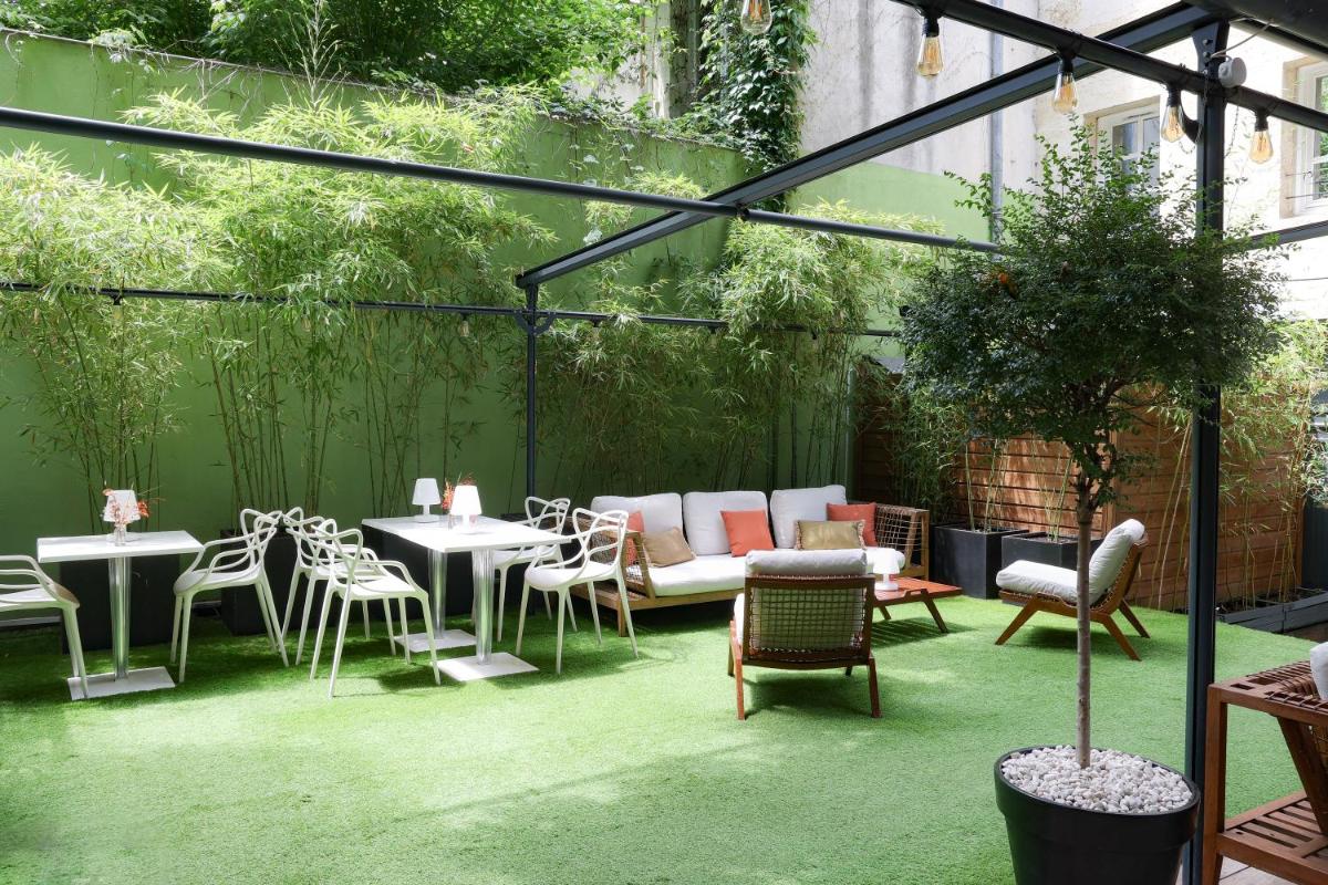 Jardin de l'établissement Le Boutique Hotel & Spa