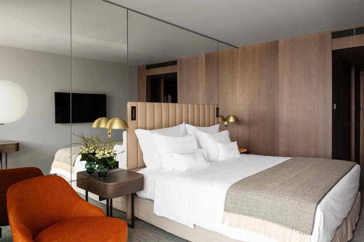 Uma cama ou camas num quarto em Altis Porto Hotel