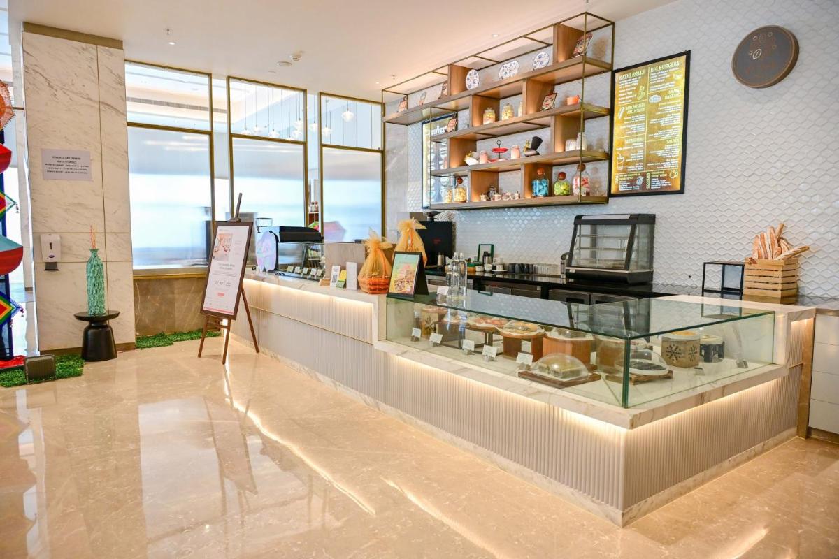 a store with a glass counter in a room at Holiday Inn Lucknow Airport by IHG in Lucknow