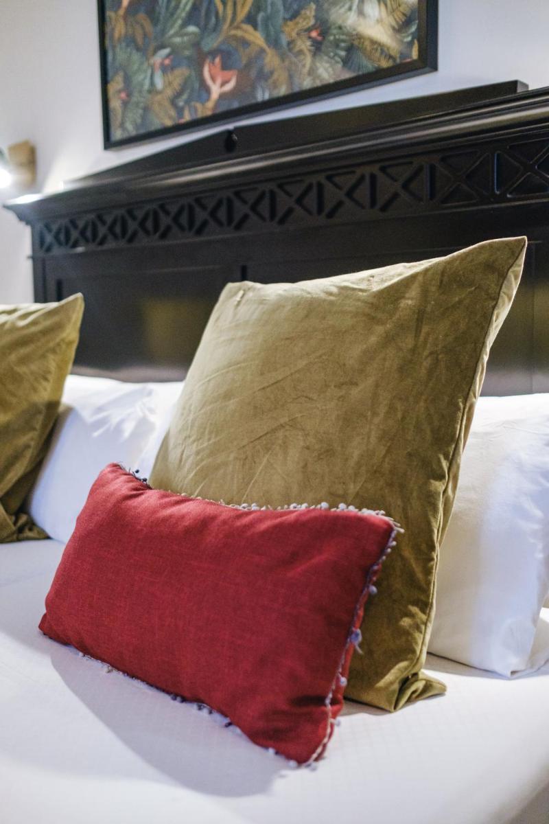 Cama o camas de una habitación en Hotel Ciutat Jardi