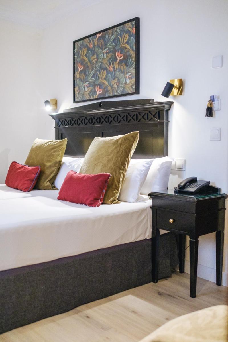 Cama o camas de una habitación en Hotel Ciutat Jardi