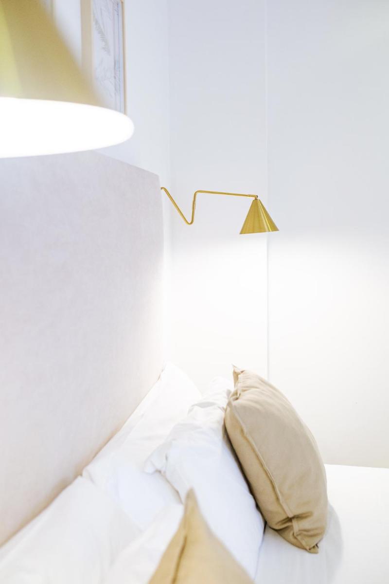 Cama o camas de una habitación en Hotel Ciutat Jardi