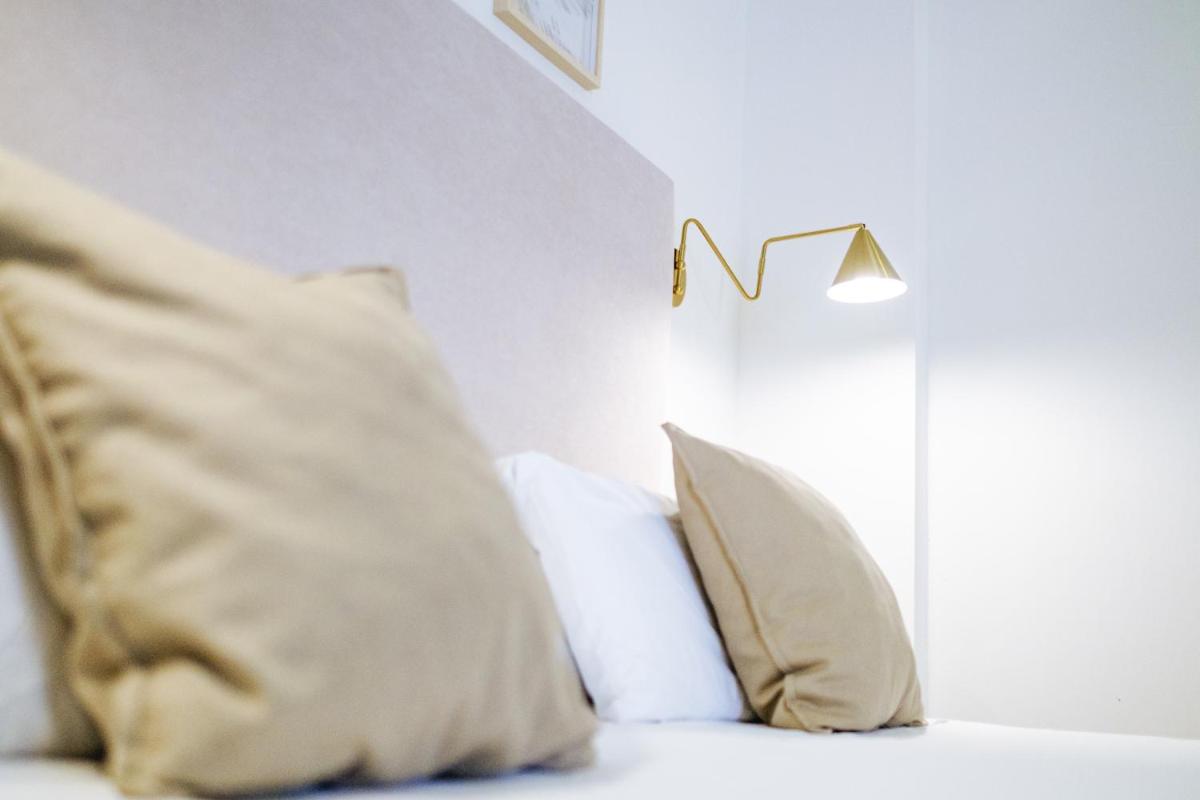 Cama o camas de una habitación en Hotel Ciutat Jardi